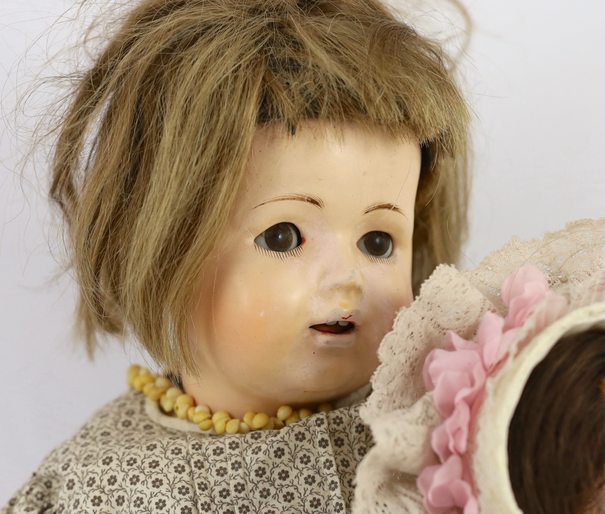 An unusual composition headed doll, German, circa 1900, 19in. (2)